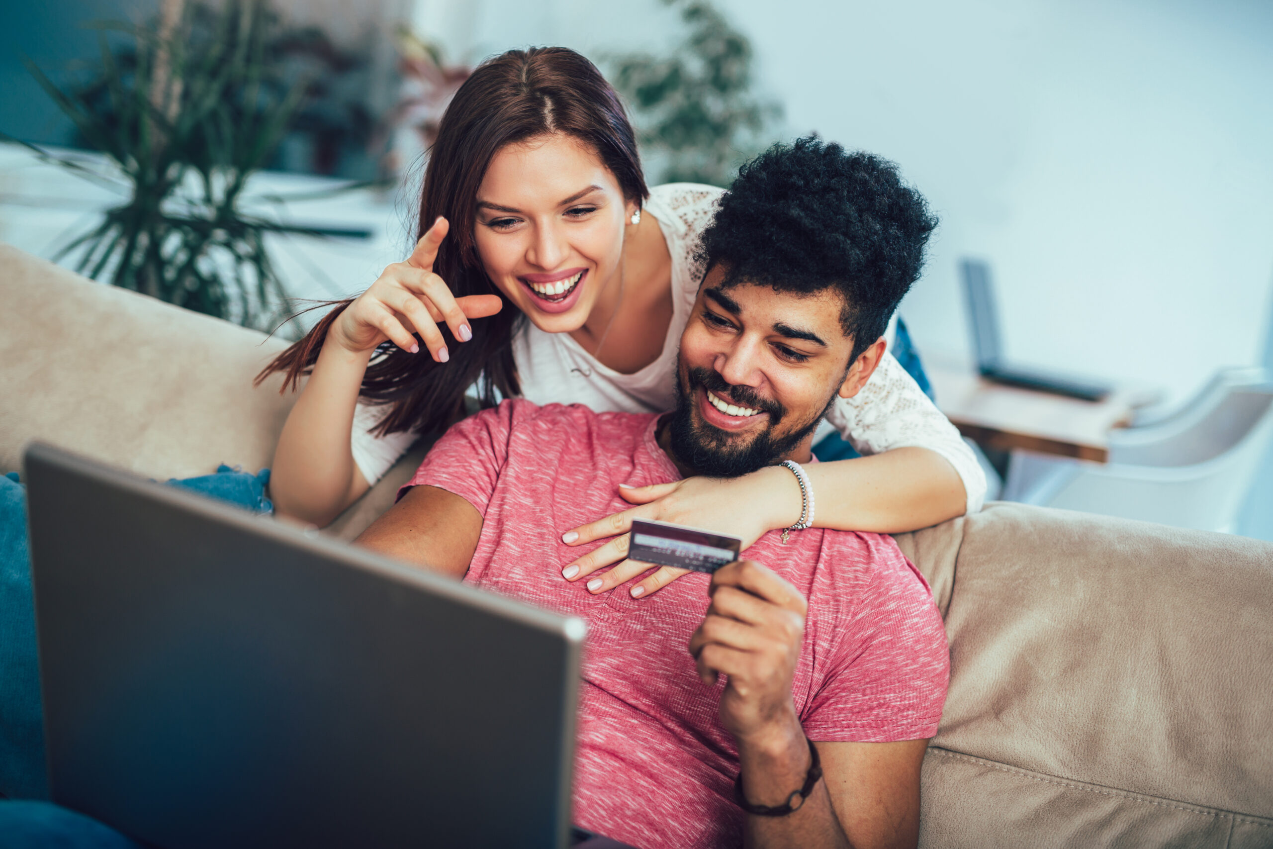 man and woman shopping online, using credit card processing
